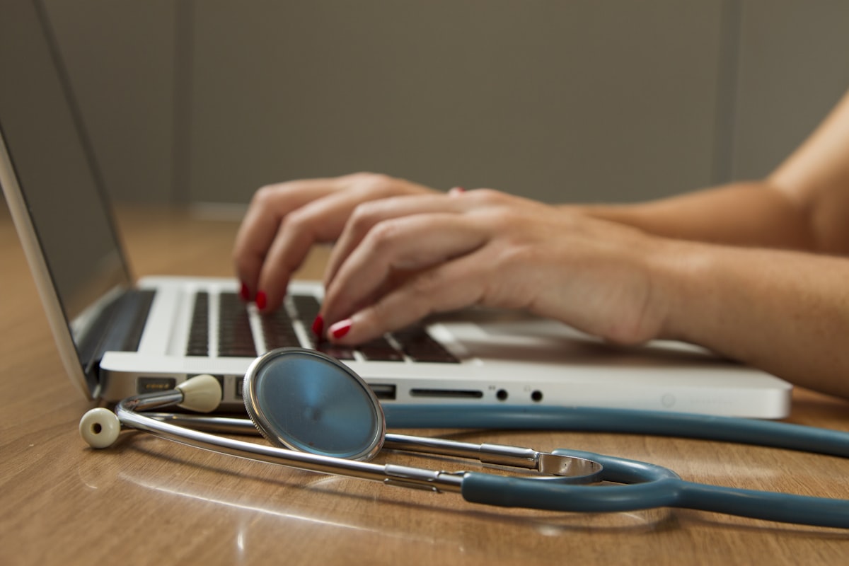 Healthcare clinic reception with patient intake paperwork